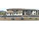 Modern townhome with a combination of stone and light siding, complemented by desert landscaping at 2121 W Sonoran Desert Dr # 45, Phoenix, AZ 85085