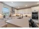 A bright kitchen with white cabinets, stainless steel appliances, and quartz countertops at 2121 W Sonoran Desert Dr # 45, Phoenix, AZ 85085
