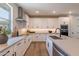 Bright modern kitchen with white cabinets, stainless steel appliances, and a large island at 2121 W Sonoran Desert Dr # 45, Phoenix, AZ 85085