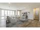 Bright living room with hardwood floors, neutral paint, modern furniture and lots of natural light at 2121 W Sonoran Desert Dr # 45, Phoenix, AZ 85085