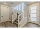 Modern staircase with natural wood treads, white risers, and plenty of natural light from nearby windows at 2121 W Sonoran Desert Dr # 45, Phoenix, AZ 85085