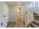 Hallway staircase with wood treads, white railing, and an open doorway leading to another room at 2121 W Sonoran Desert Dr # 45, Phoenix, AZ 85085