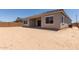 Backyard featuring a covered patio and view of the home's exterior at 21640 E Roundup Way, Queen Creek, AZ 85142