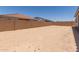 Spacious backyard featuring a large, enclosed lot with potential for landscaping and outdoor enjoyment at 21640 E Roundup Way, Queen Creek, AZ 85142