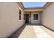 Charming front entrance with a covered porch and landscaped walkway at 21640 E Roundup Way, Queen Creek, AZ 85142