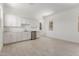 Bright kitchenette with white cabinets, countertops, and stainless steel dishwasher at 21640 E Roundup Way, Queen Creek, AZ 85142