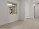 Bright living room featuring tile flooring and a window with natural light at 21640 E Roundup Way, Queen Creek, AZ 85142
