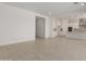 Bright, open-concept living room with tile floors at 21640 E Roundup Way, Queen Creek, AZ 85142