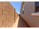 Narrow side yard featuring a block wall, providing privacy and security at 21640 E Roundup Way, Queen Creek, AZ 85142
