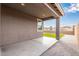 The covered back patio leads to a backyard with artificial grass and gravel at 2235 W Park St, Phoenix, AZ 85041
