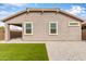 Home backyard featuring low maintenance gravel ground cover and a patch of artificial turf at 2235 W Park St, Phoenix, AZ 85041