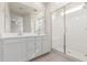 Bright bathroom features double sinks, large mirror and glass shower enclosure at 2235 W Park St, Phoenix, AZ 85041