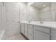 A full bathroom featuring a dual sink vanity with white cabinets and tile floors at 2235 W Park St, Phoenix, AZ 85041
