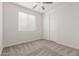 Bedroom featuring carpet flooring, closet with sliding doors and window with blinds at 2235 W Park St, Phoenix, AZ 85041
