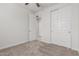 Bedroom featuring carpet flooring, a ceiling fan, and closet with sliding doors at 2235 W Park St, Phoenix, AZ 85041