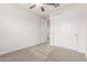 Bedroom featuring a ceiling fan, carpet flooring, and closet with sliding doors at 2235 W Park St, Phoenix, AZ 85041