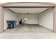This is a large garage with a refrigerator and some trash cans at 2235 W Park St, Phoenix, AZ 85041