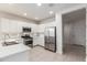 Modern kitchen with stainless steel appliances, white cabinets, and ample counter space at 2235 W Park St, Phoenix, AZ 85041