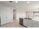 Bright kitchen features stainless appliances, center island, and flows into the living area at 2235 W Park St, Phoenix, AZ 85041
