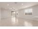 Spacious living area featuring tile floors, recessed lighting, and sliding glass doors to the patio at 2235 W Park St, Phoenix, AZ 85041