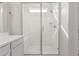 Bright bathroom features glass enclosed walk-in shower with a built in seat at 2235 W Park St, Phoenix, AZ 85041