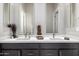 Elegant bathroom with dual vanity, modern faucets, and decorative accents at 2415 W Hazelhurst Ct, Anthem, AZ 85086