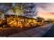 Charming single-story home with desert landscaping at twilight at 2415 W Hazelhurst Ct, Anthem, AZ 85086
