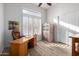 Bright home office featuring a spacious desk, modern decor, and a large window at 2415 W Hazelhurst Ct, Anthem, AZ 85086