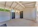 Covered back patio area with a gate, perfect for outdoor living and entertaining at 2425 E Harvard St, Phoenix, AZ 85008