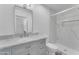 Modern bathroom features marble countertops, stylish vanity, and a luxurious tiled walk-in shower at 2425 E Harvard St, Phoenix, AZ 85008