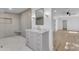 Bathroom boasts a marble tile floor, modern vanity, and glass walk-in shower at 2425 E Harvard St, Phoenix, AZ 85008