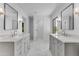Bathroom featuring dual sinks, modern lighting, and marble floors at 2425 E Harvard St, Phoenix, AZ 85008