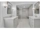Beautiful bathroom featuring dual sinks and a modern glass enclosed shower at 2425 E Harvard St, Phoenix, AZ 85008
