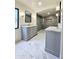 Beautiful bathroom featuring dual vanities, marble floors and modern finishes at 2425 E Harvard St, Phoenix, AZ 85008
