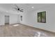 Bright bedroom with wood-look flooring, modern windows, a ceiling fan and neutral walls at 2425 E Harvard St, Phoenix, AZ 85008