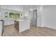 Bright kitchen featuring a quartz island, modern stainless steel appliances, and white cabinetry at 2425 E Harvard St, Phoenix, AZ 85008