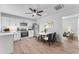 Well lit kitchen with white cabinetry, stainless steel appliances and wood-look vinyl flooring at 2425 E Harvard St, Phoenix, AZ 85008