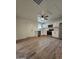 Open kitchen features white cabinets, stainless steel appliances and wood-look flooring at 2425 E Harvard St, Phoenix, AZ 85008