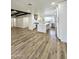 Open kitchen boasts stainless appliances, wood floors, a stylish island, and plenty of counter space at 2425 E Harvard St, Phoenix, AZ 85008