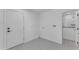 Bright laundry room with stylish tile floors, washer/dryer hookups and access to a modern bathroom at 2425 E Harvard St, Phoenix, AZ 85008
