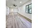 Spacious living room with wood-look floors, fresh paint and modern ceiling fan at 2425 E Harvard St, Phoenix, AZ 85008