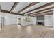 Bright, open living space with wood beam ceilings and fireplace feature at 2425 E Harvard St, Phoenix, AZ 85008
