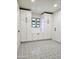 View of a modern mud room featuring stylish tile flooring and custom white cabinetry at 2425 E Harvard St, Phoenix, AZ 85008