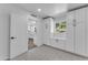 Mudroom with storage and seating featuring a view of the kitchen at 2425 E Harvard St, Phoenix, AZ 85008