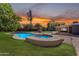 Backyard pool and spa with concrete surround at 2425 E Harvard St, Phoenix, AZ 85008