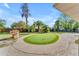 Beautiful backyard putting green with well-maintained turf and mature trees, perfect for golf enthusiasts at 2425 E Harvard St, Phoenix, AZ 85008