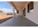 Large covered back patio with sliding doors, creating seamless indoor-outdoor flow at 25215 N 131St Dr, Peoria, AZ 85383