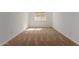 An empty bedroom with neutral carpet, white walls, and a window creating a serene and adaptable living space at 25215 N 131St Dr, Peoria, AZ 85383