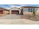 Single-Gathering home showcasing brick driveway, manicured yard, and a two-car garage at 25215 N 131St Dr, Peoria, AZ 85383