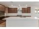 Modern kitchen featuring a large island, stainless steel appliances, and ample cabinet space at 25215 N 131St Dr, Peoria, AZ 85383